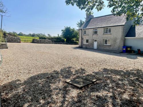 a driveway with a house in the background at Country Farm House in Bruckless