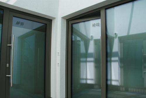 a pair of glass doors in a building at myQuartier City Chalets in Innsbruck