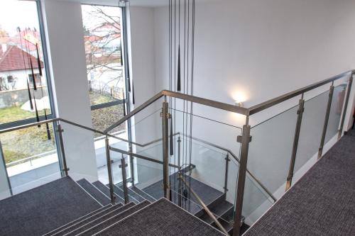 a staircase in a building with a window at Guest House Frizzante in Turčianske Teplice