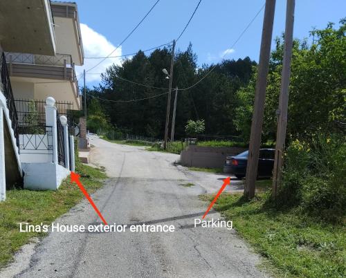 a street with a house exterior entrance and a car parked at Lina's House Pramanta in Pramanta