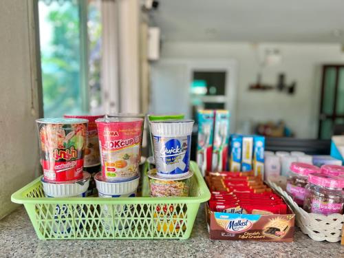 a group of containers of food sitting on a counter at Srivara Place โรงแรมศรีวรา เพลส in Phetchabun