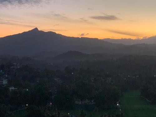 a view of a mountain at sunset at Galkaduwa360 Villa in Kandy