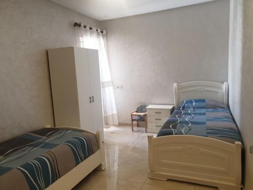 Ένα ή περισσότερα κρεβάτια σε δωμάτιο στο Apartment Anis Nador Al Jadid