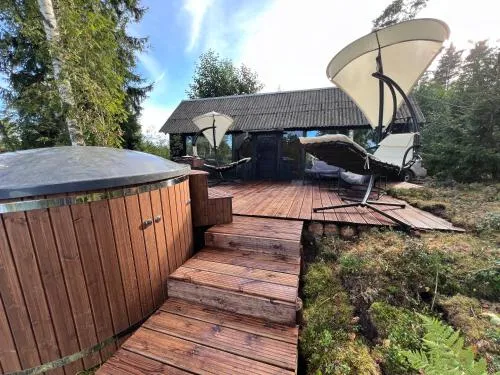Black house in the forest with Hot Tube and Home theater for movies
