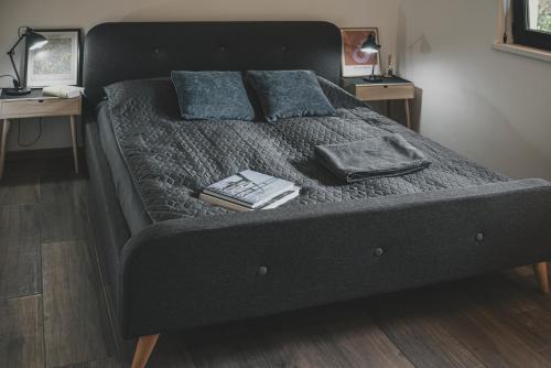 a bed with two pillows on top of it at Room&Garden in Mtskheta