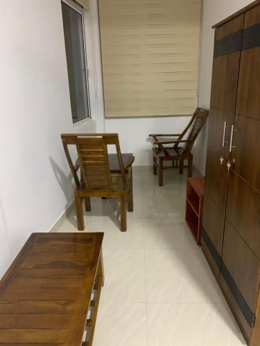 two chairs and a table in a room at Galkaduwa360 Villa in Kandy