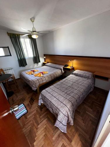 Postel nebo postele na pokoji v ubytování Hotel Bari