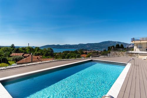 a swimming pool on top of a house at Oasi Attico in Cissano