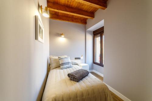 a bedroom with a bed with pillows on it at Hotel Rural SOL in Piedrahita de Castro