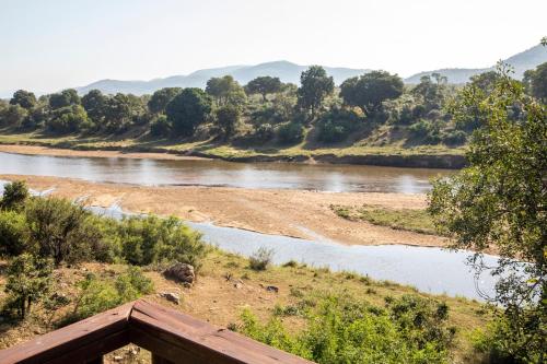 a view of a river from a bridge at Hennie's Rest in Malelane