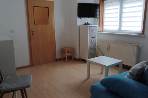 a living room with a couch and a table at Ferienhaus Anna Altstadt von Sonneberg in Sonneberg