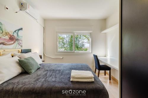 Postel nebo postele na pokoji v ubytování Apto aconchegante bem localizado em POA - RFA303