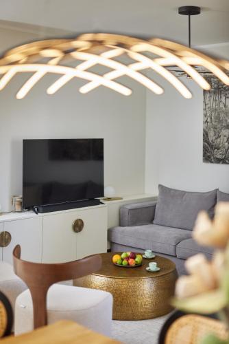 a living room with a couch and a table at Dimitris Residence in Tivat