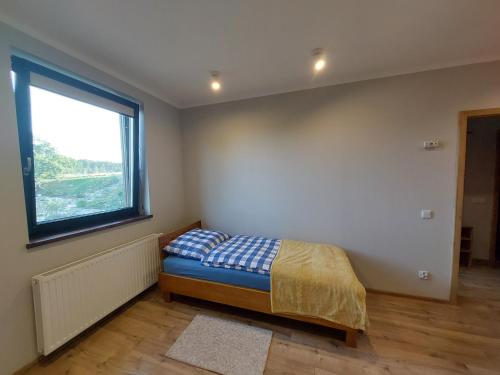Ένα ή περισσότερα κρεβάτια σε δωμάτιο στο Apartament Blisko Lasu