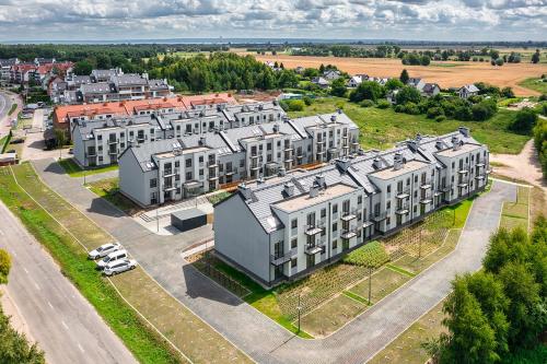 an aerial view of a building in a city at Trimare Blue Apartament Sztutowo in Sztutowo