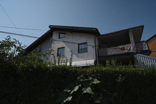 a white house with a window on the side of it at OFOO Zagreb in Zagreb