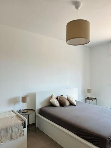 Katil atau katil-katil dalam bilik di Alloggio a 150m dal mare con grande terrazza