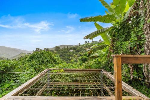 a cage on top of a mountain with trees at Casa Serenidad en las Montañas in Orocovis