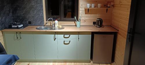 a kitchen with a sink and a counter top at My house in Stepantsminda
