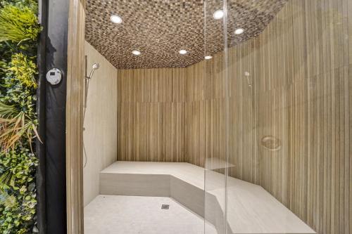 a sauna is shown with a glass wall at Beach Resort condo 921 in Miami Beach