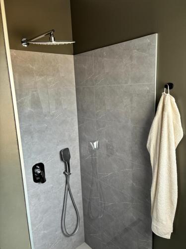 a shower in a bathroom with a shower at Villa Panorama Rakitno in Posušje