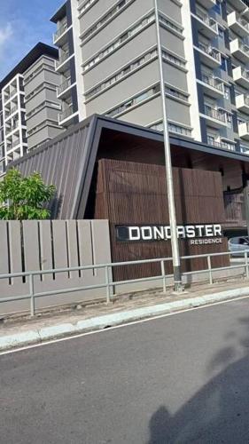 a building with a dont enter sign in front of a building at Yumi Staycation 3R2B, Doncaster Residence in Maong Bazaar