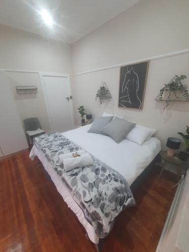 a bedroom with a large white bed in a room at One Three Nine On Roberts in Pietermaritzburg