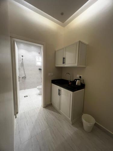 a bathroom with a sink and a toilet and a shower at Deluxe Boho - Self Check-in in Riyadh