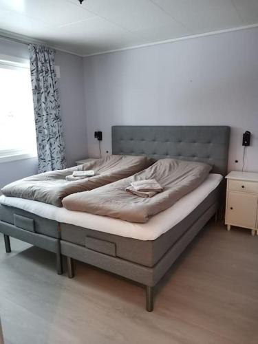 a bedroom with two beds in a room at Fjellhagen - Geirangerfjord view in Hellesylt