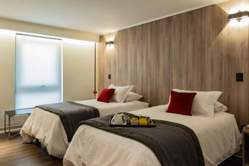 Postel nebo postele na pokoji v ubytování Hotel H9