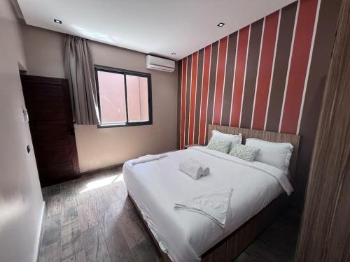Postel nebo postele na pokoji v ubytování Appartement No 1 vue sur la cour