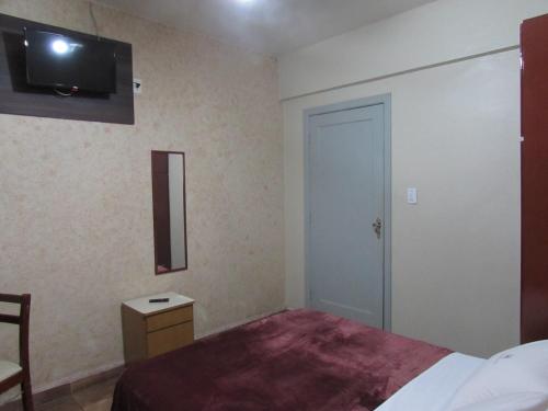Katil atau katil-katil dalam bilik di New Comercial Palace Hotel