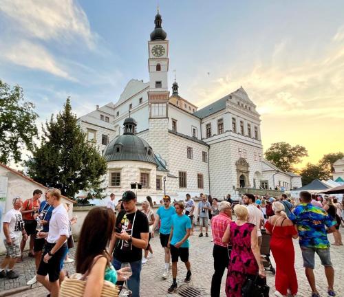 a crowd of people standing in front of a building at Barokní dům u Panny Marie in Pardubice