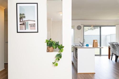a kitchen and a living room with a table at Family Home for a Fiesta in Smithfield