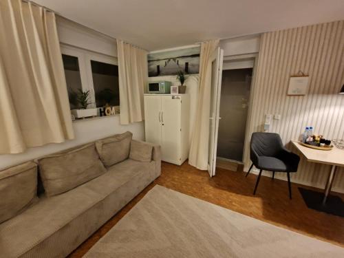 a living room with a couch and a table at Ferienwohnung Nachtigall 3 in Bad Hersfeld