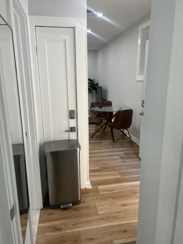 a hallway with a room with a table and a door at 2BR Columbia Heights APT Walk 2 Metro & Shops in Washington