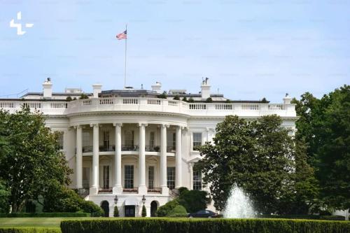the white house with a flag on top of it at 2BR Columbia Heights APT Walk 2 Metro & Shops in Washington