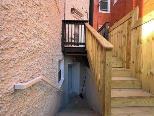 an alley with stairs and a balcony on a building at 2BR Columbia Heights APT Walk 2 Metro & Shops in Washington