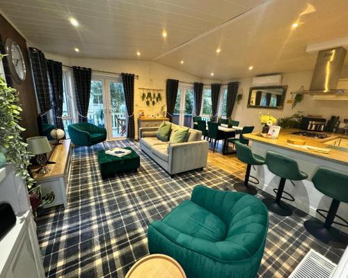 a living room with a couch and a table at Meadows 90 - Southview Holiday Park Skegness in Skegness