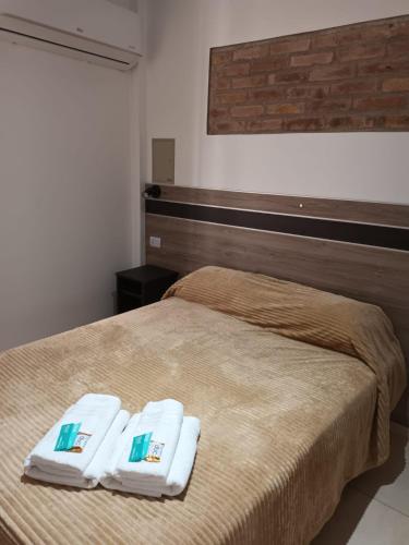 Postel nebo postele na pokoji v ubytování Grace Apartaments