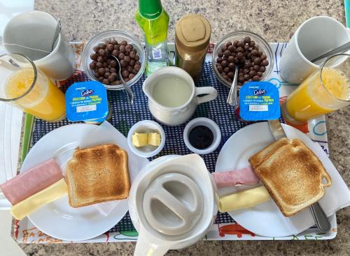 a tray of breakfast foods with toast and eggs at Nido de Cóndores in Santiago