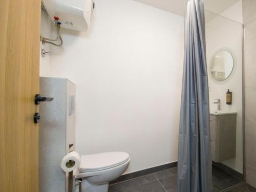 a bathroom with a toilet and a shower at Motel Anić in Novi Travnik