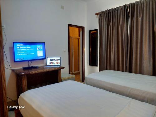 Postel nebo postele na pokoji v ubytování Hotel Residencial Ramire-Tour
