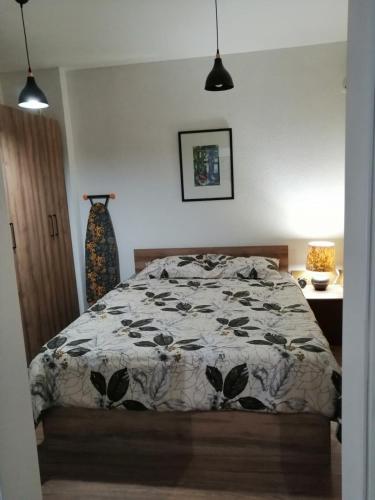 Llit o llits en una habitació de RUŽA Apartment