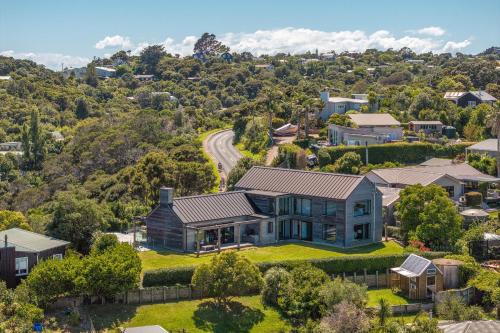 an aerial view of a house in a suburb at Pacific Escape, Oneroa - Be My Guest Waiheke in Oneroa