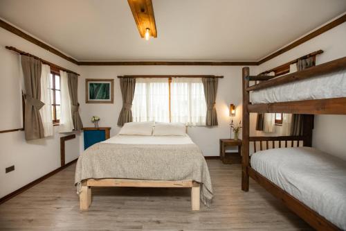 Ένα ή περισσότερα κρεβάτια σε δωμάτιο στο Rustika Hotel