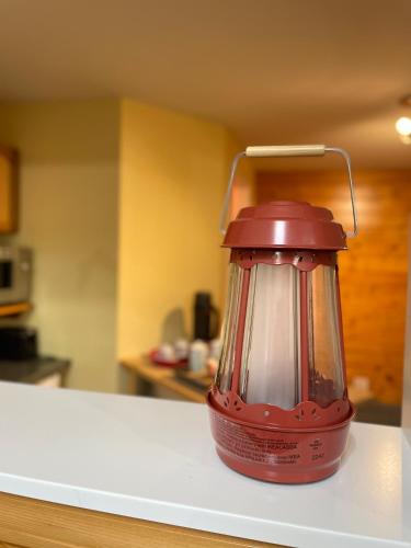 a red blender sitting on top of a counter at Whispering Pines Farmhouse in Redmond