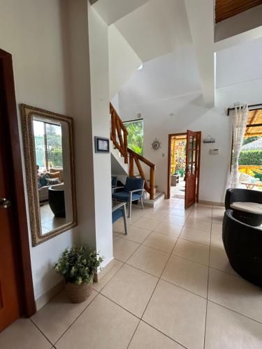 a hallway of a house with a mirror at Casa Otti-Olón in Olón