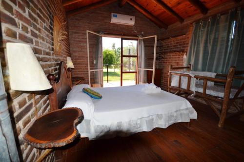 Postel nebo postele na pokoji v ubytování El Viejo Molino Casas de Campo