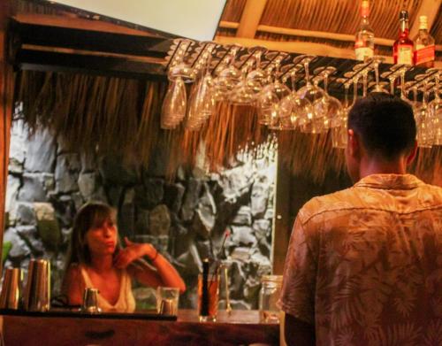 a man standing in front of a mirror with a woman at Casa Pepe in Sayulita